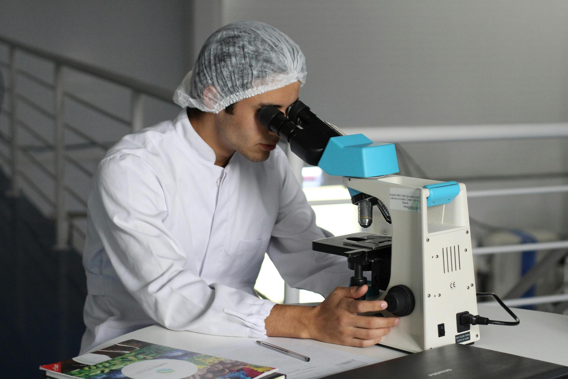 Research team analyzing biological samples under a microscope.