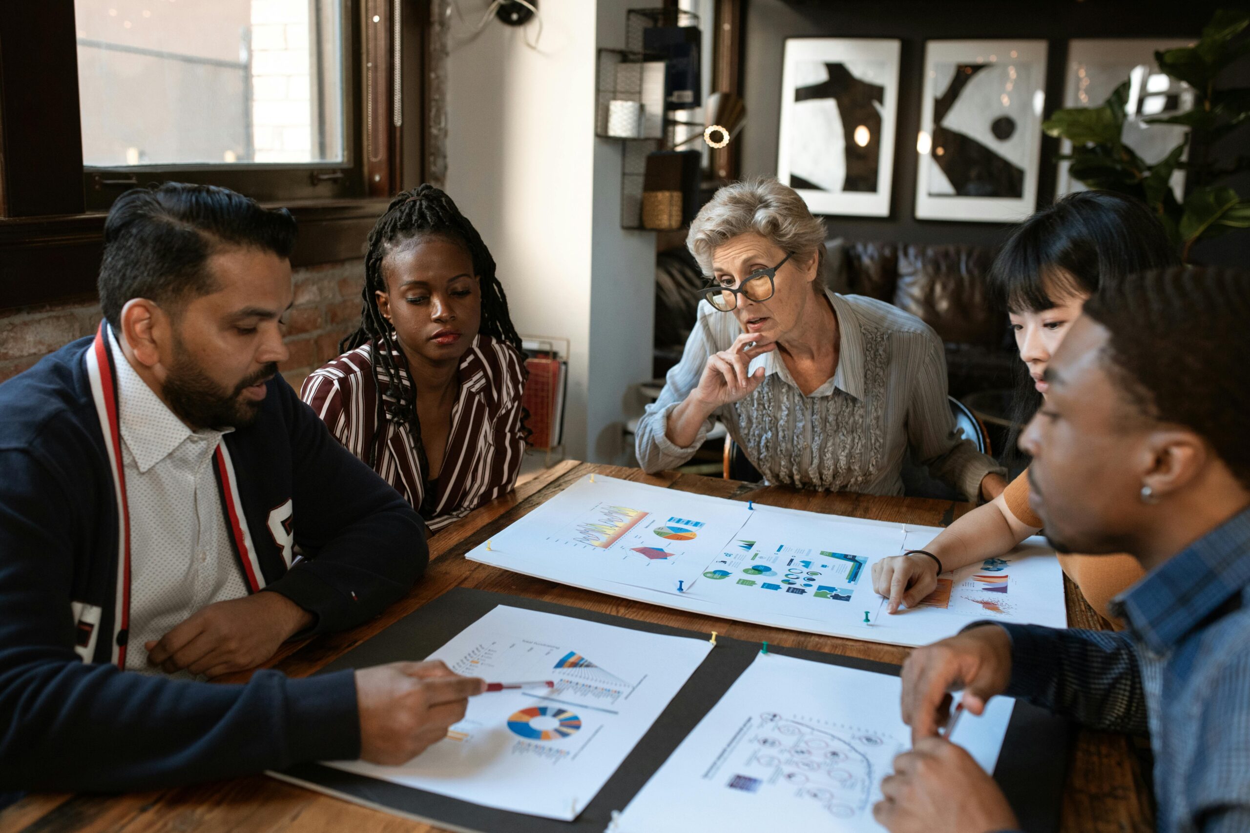 Research team analyzing biological data for new drug discovery.