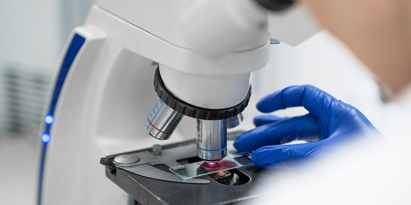Close-up of a microscope being used for scientific R&D.