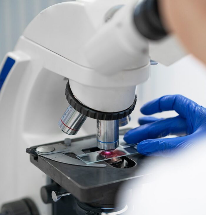 Close-up of a microscope being used for scientific R&D.