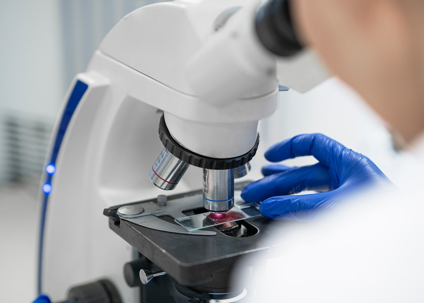 Close-up of a microscope being used for scientific R&D.