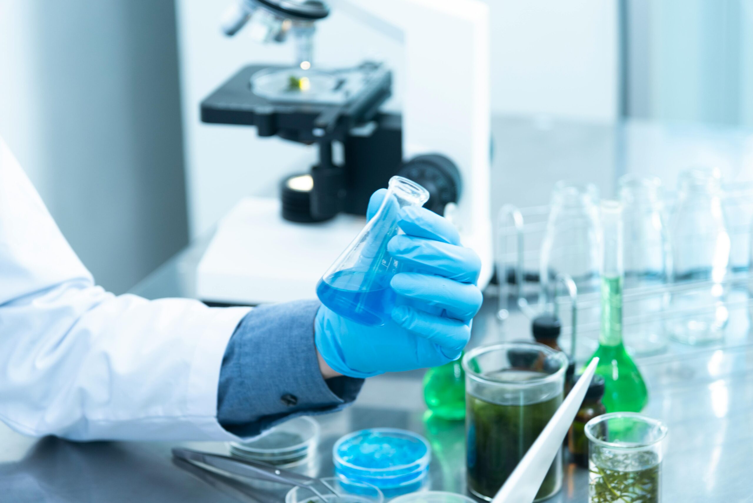 Laboratory setting with researchers testing new pharmaceutical compounds.